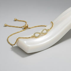 CUBIC ZIRCONIA COLLECTION - ADJUSTABLE CRYSTAL INFINITY BRACELET - GOLD (BRA25)