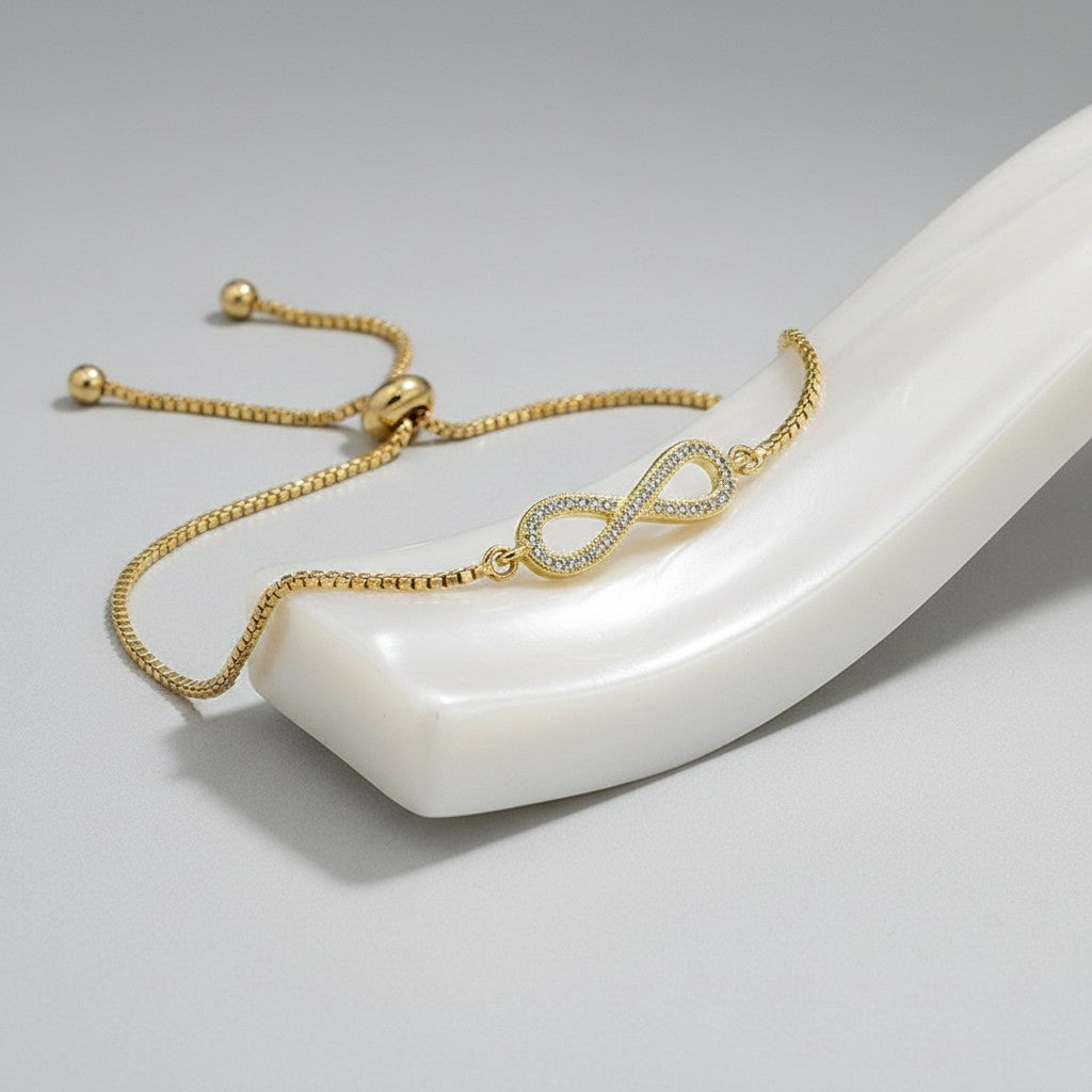 CUBIC ZIRCONIA COLLECTION - ADJUSTABLE CRYSTAL INFINITY BRACELET - GOLD (BRA25)
